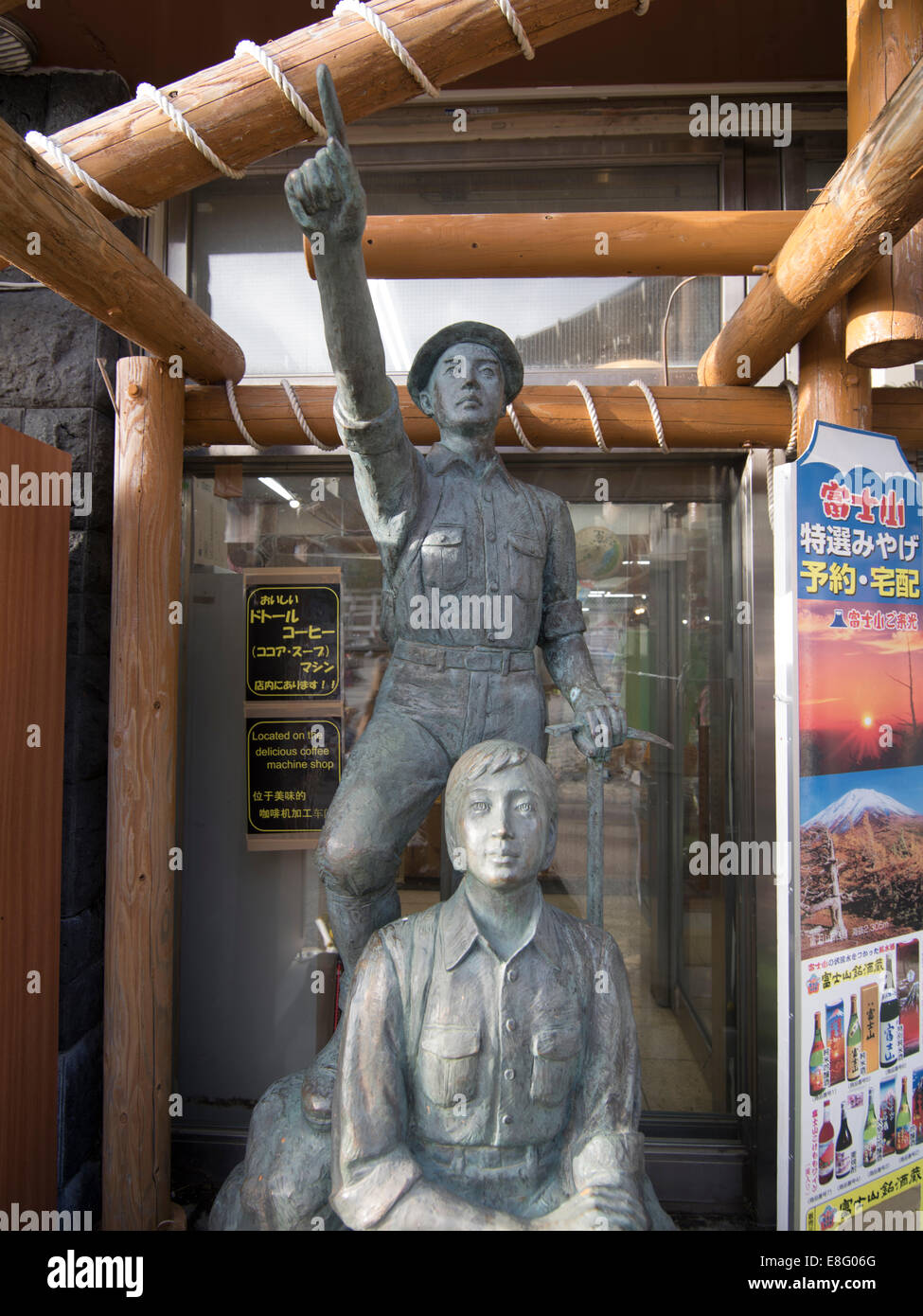 Statue of young Japanese men pointing to the summit at  Fuji Subaru Line 5th Station on Mount Fuji. Stock Photo