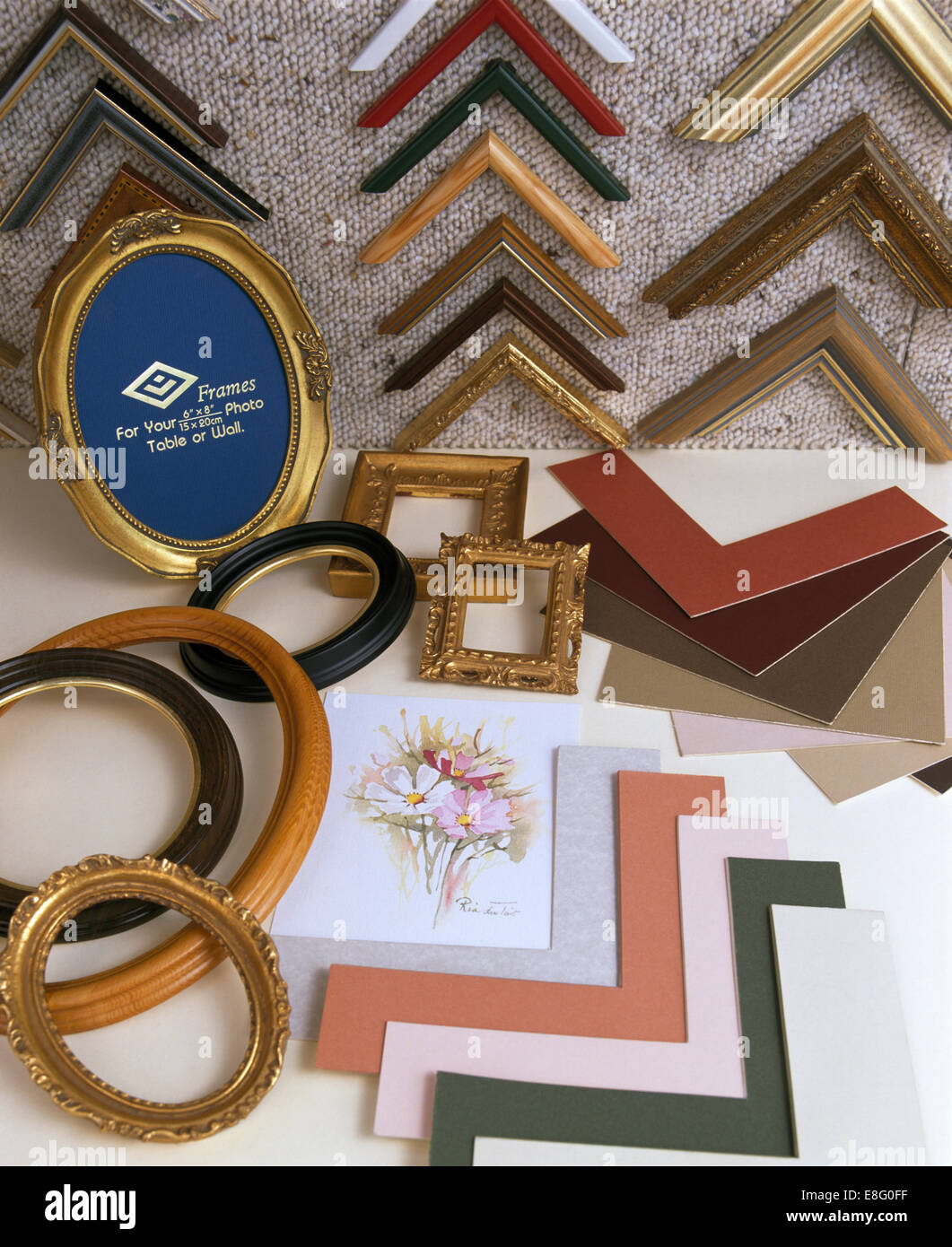 Closeup of a selection of wooden picture frames with sample frames and cardboard mounts Stock