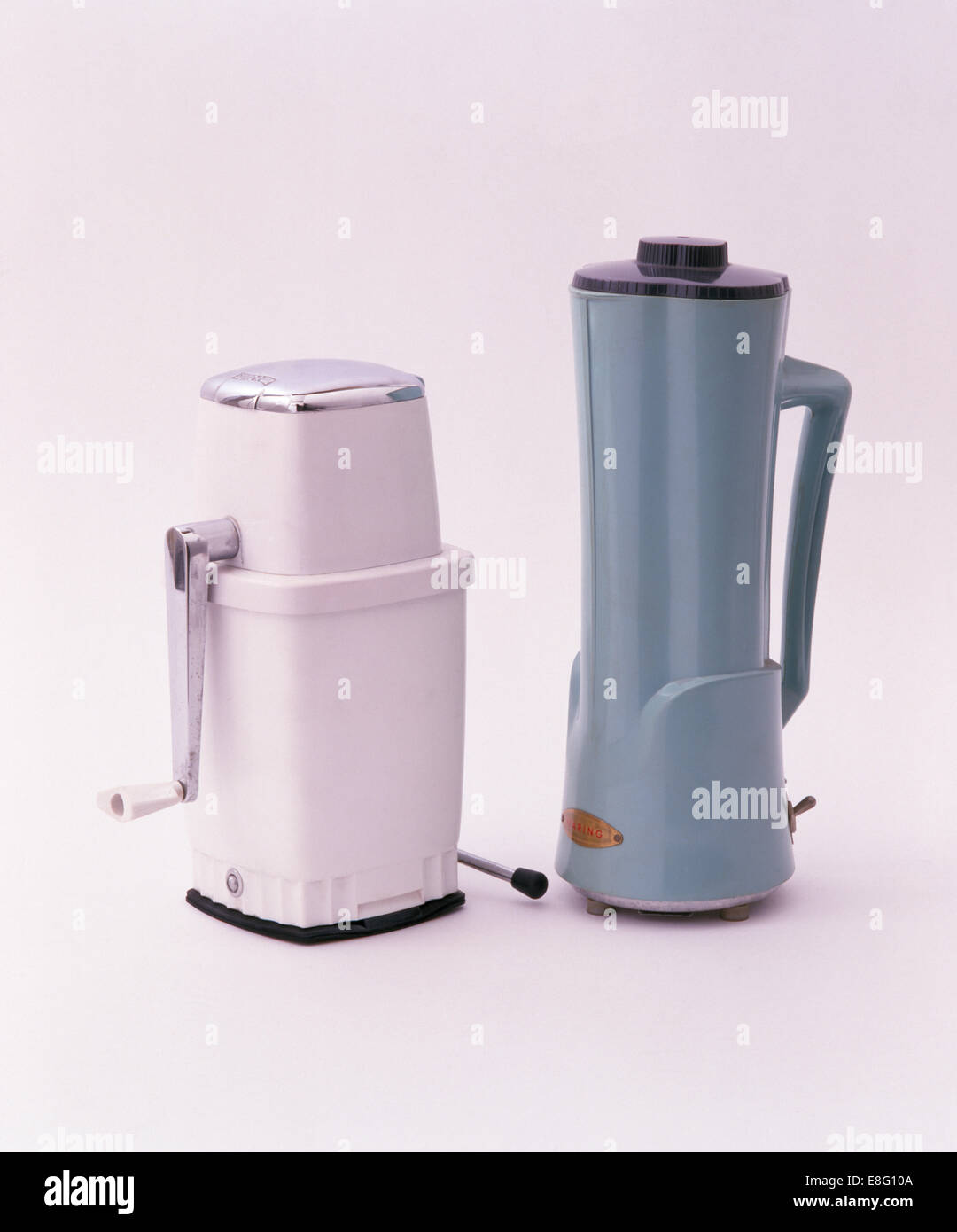 Closeup of mechanical coffee grinder and blue coffee percolator Stock
