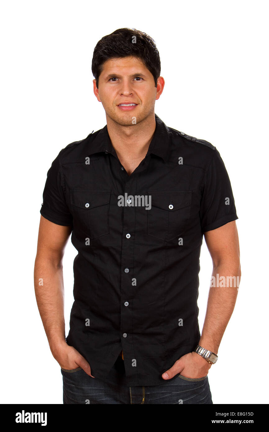 Confident and handsome young man with his hands in his pockets smiles positively. Stock Photo