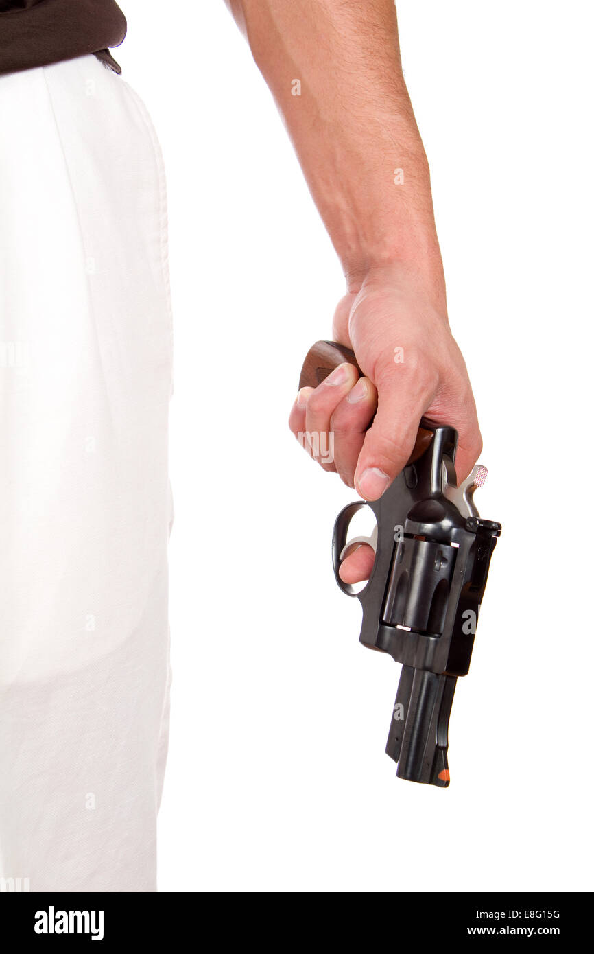 Violent man holds a 357 magnum revolver at his side with his finger on the trigger. Stock Photo