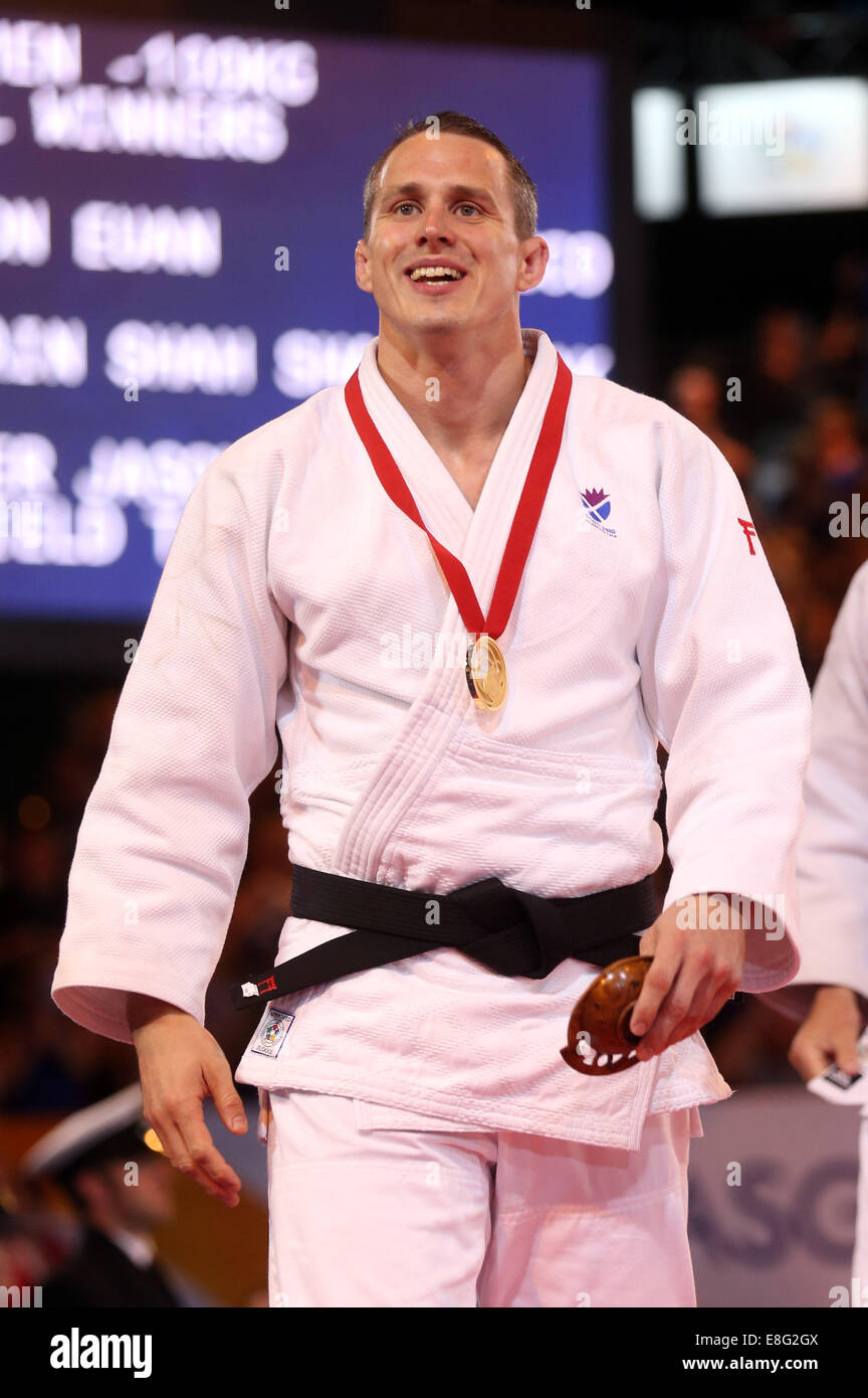 Medal Ceremony. Euan Burton (SCO) collects his Gold Medal - Judo -100kg  Final - SECC - Glasgow Scotland, UK - 260714 - Glasgow Stock Photo - Alamy