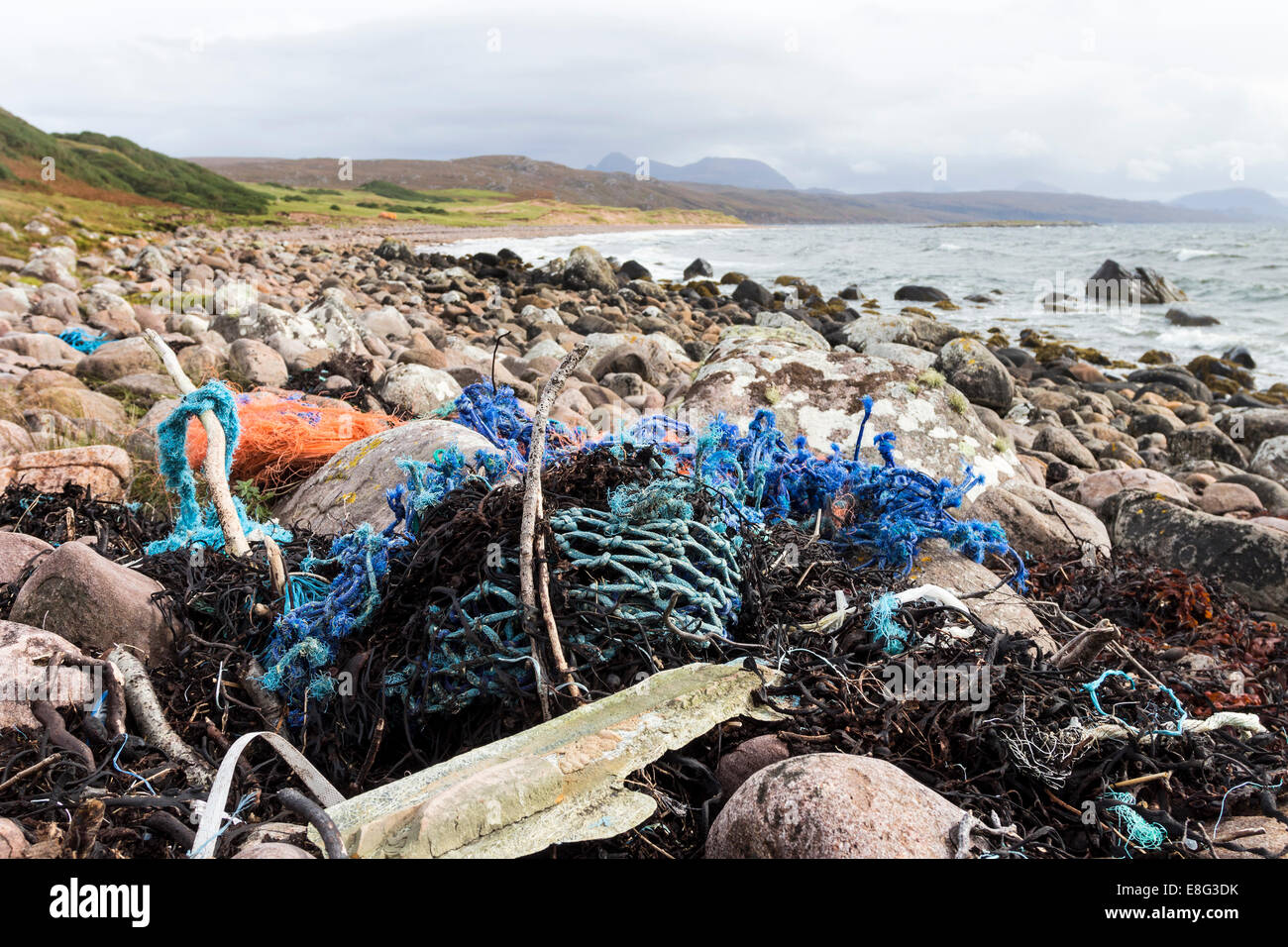 Plastic Detritus Such as Fishing Nets and Rope on the Southern Beach of Red Point, West Coast of Scotland Stock Photo