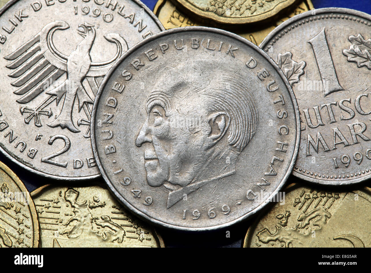 Coins of Germany. German statesman Konrad Adenauer and the German eagle depicted in old Deutsche Mark coins. Stock Photo