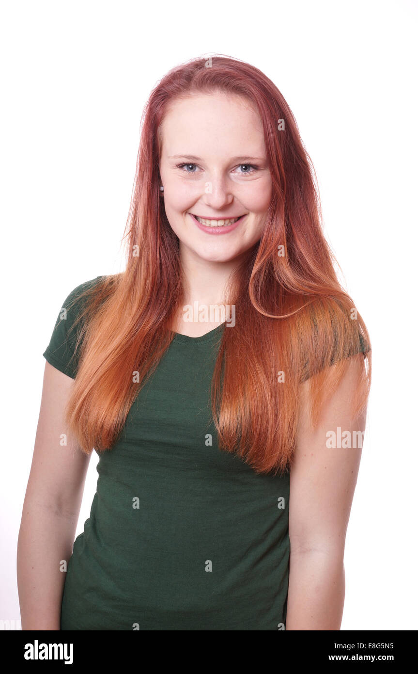 smiling young woman with long red hair Stock Photo