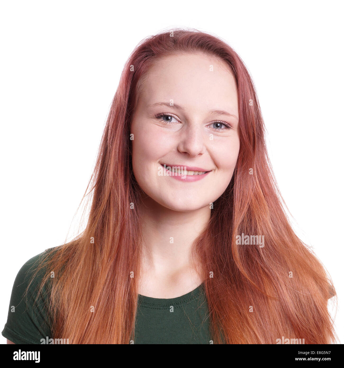 smiling young woman with long red hair Stock Photo