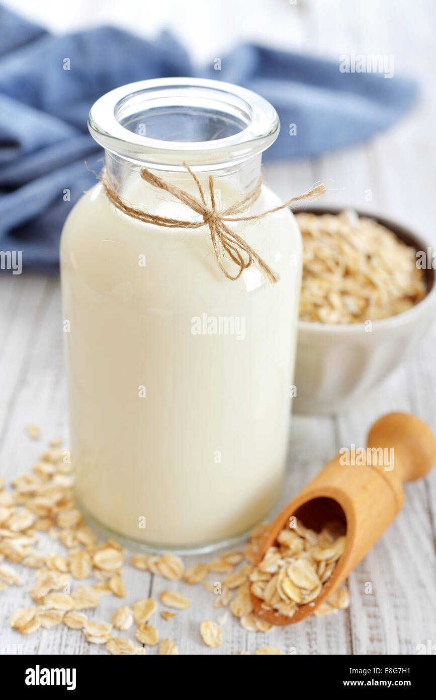 https://c8.alamy.com/comp/E8G7H1/oat-milk-in-bottle-on-white-wooden-background-vegan-and-vegetarian-E8G7H1.jpg