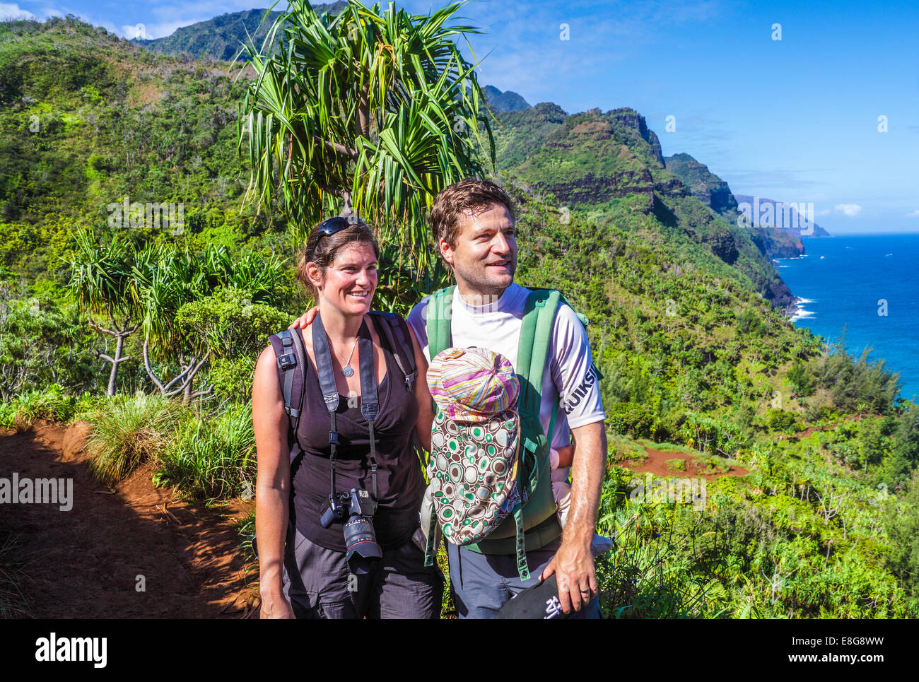 Hikers with baby on the Kalalau Trail in Kauai Stock Photo