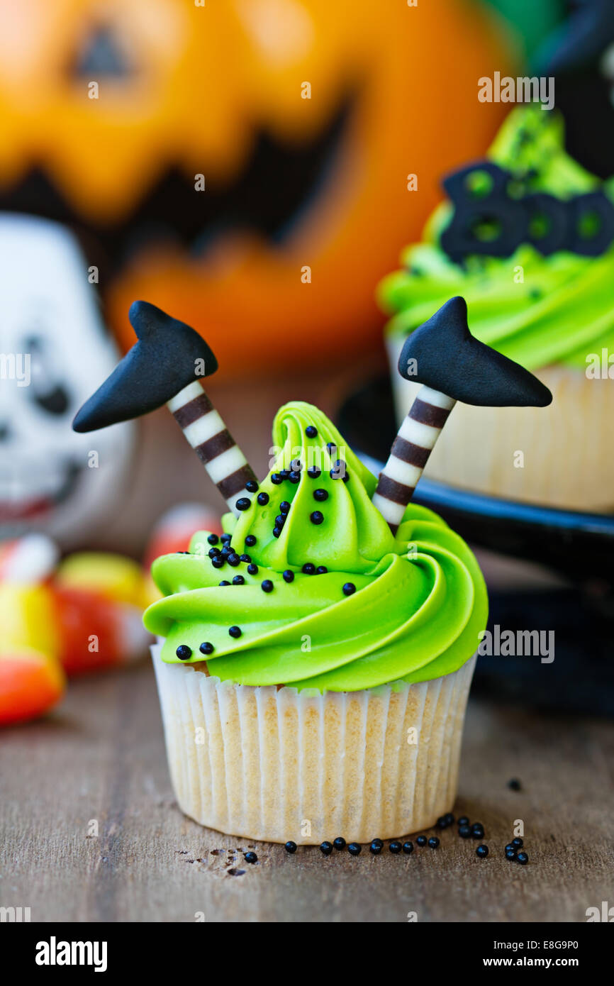 Cupcake with witch's legs Stock Photo