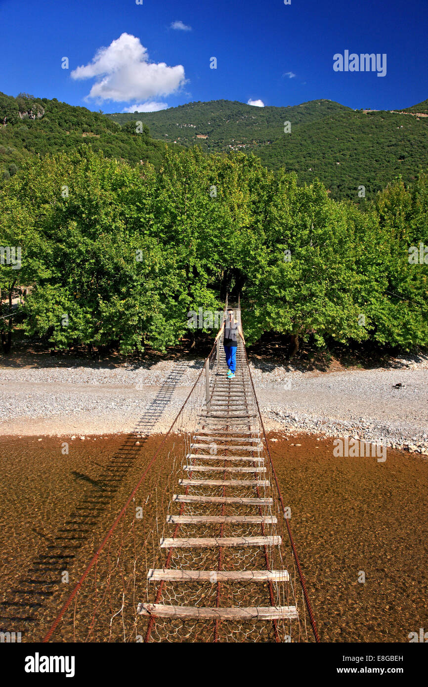 Suspended pedestrians' bridge over Evinos river, connecting the regions of Thermo and Nafpaktia, Aitoloakarnania, Greece. Stock Photo