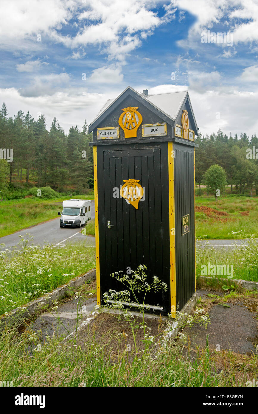 Motorhome by heritage listed British Automobile Association (AA) phone box at isolated road junction Glen Dye Scottish highlands Stock Photo