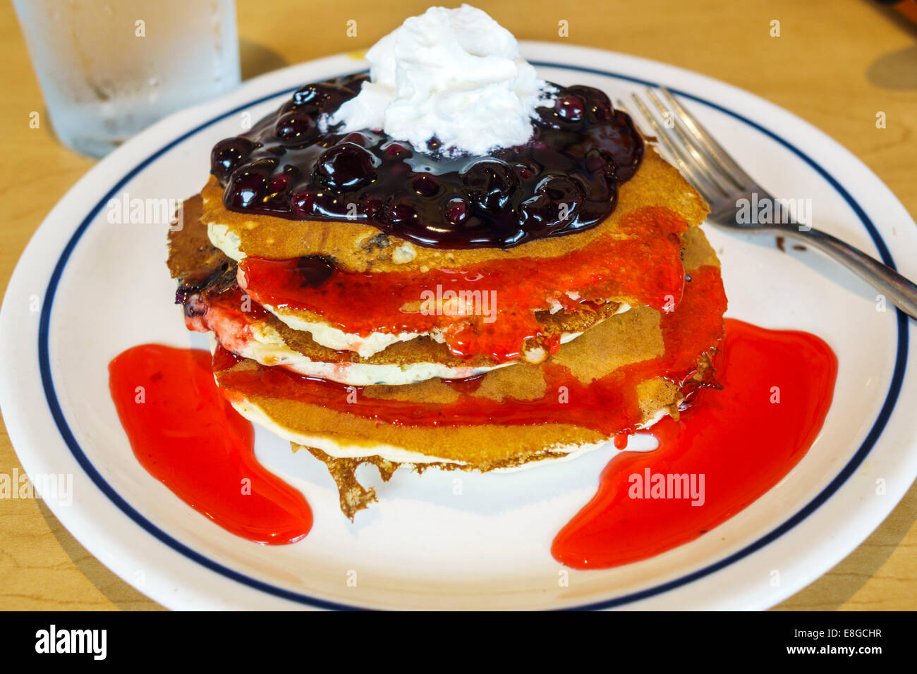 Naples Florida,IHOP,restaurant restaurants food dining eating out cafe cafes bistro,interior inside,plate,dish,pancakes,stack,syrup,blueberry,visitors Stock Photo