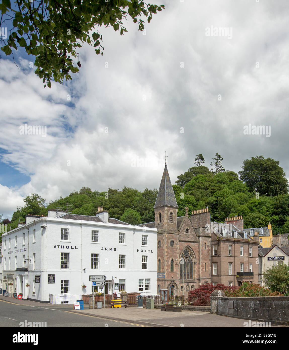 Main street buildings, including historic 19th century Atholl Arms Hotel and old church in Scottish town of Dunkeld Stock Photo