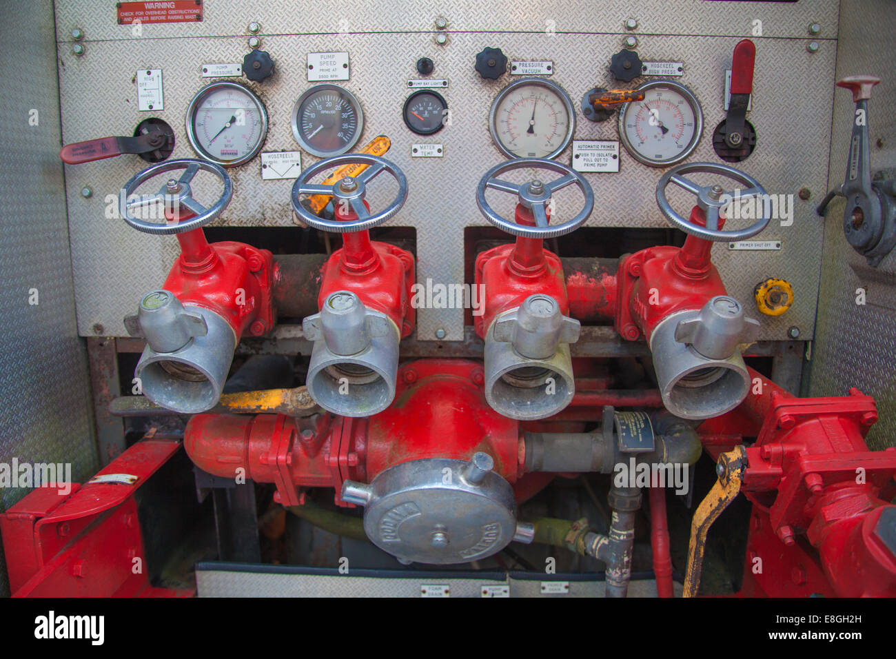 Scrapped fire engine pump valves and gauges Stock Photo