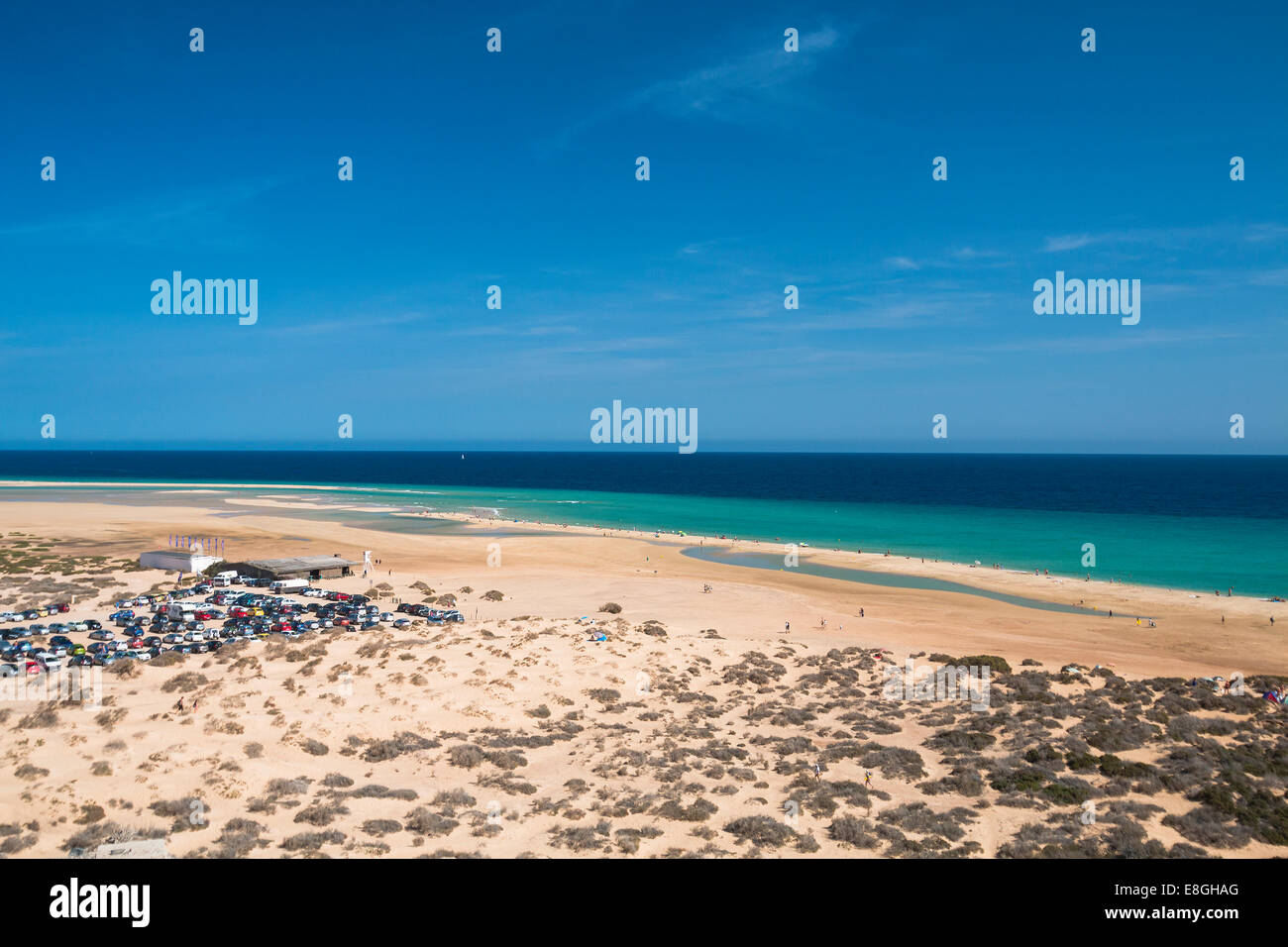 Parking lot and the famous lagoon in Risco El Paso at Playas de Sotavento, Fuerteventura Stock Photo