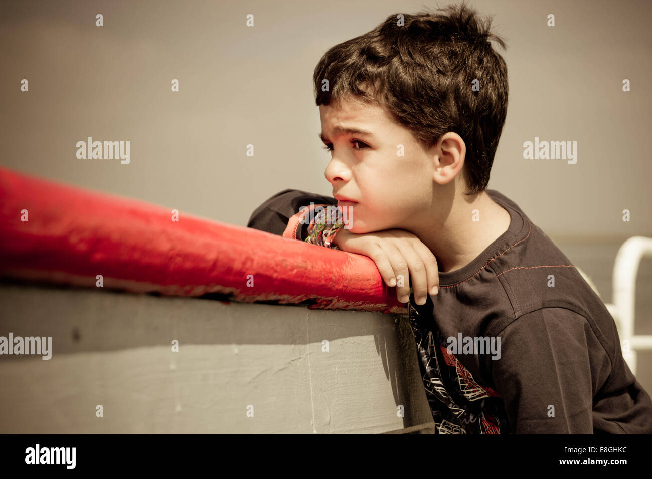 Spain, Portrait of melancholic boy Stock Photo
