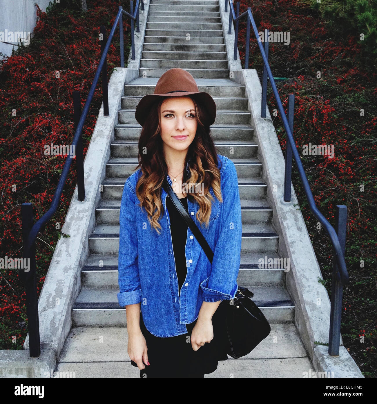 USA, Portrait of young woman wearing hat Stock Photo