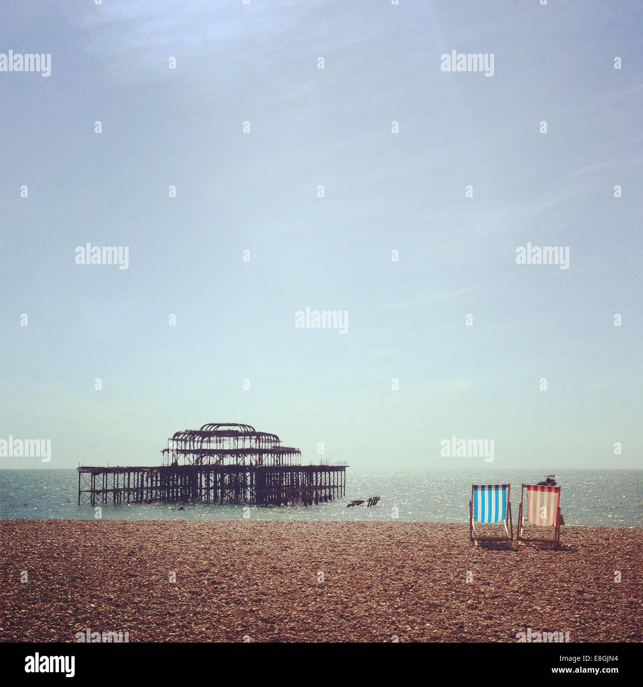 Two deck chairs on brighton beach hi-res stock photography and images ...