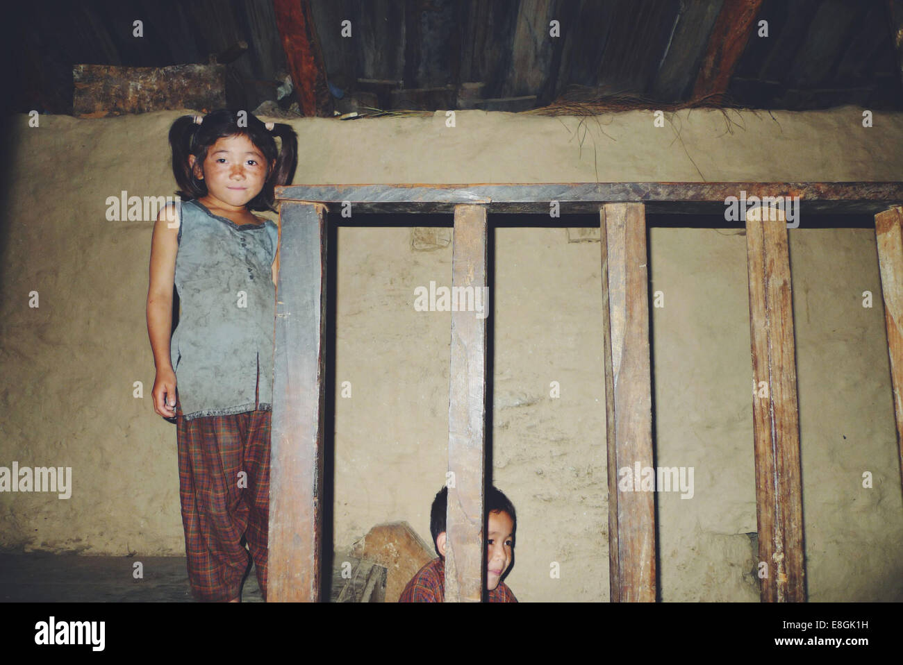 Portrait of two sisters in a traditional Nepalese house, Nepal Stock Photo
