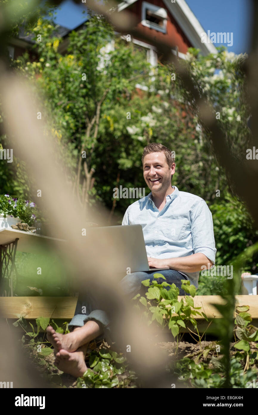 Adult man seated relaxing hi-res stock photography and images - Alamy