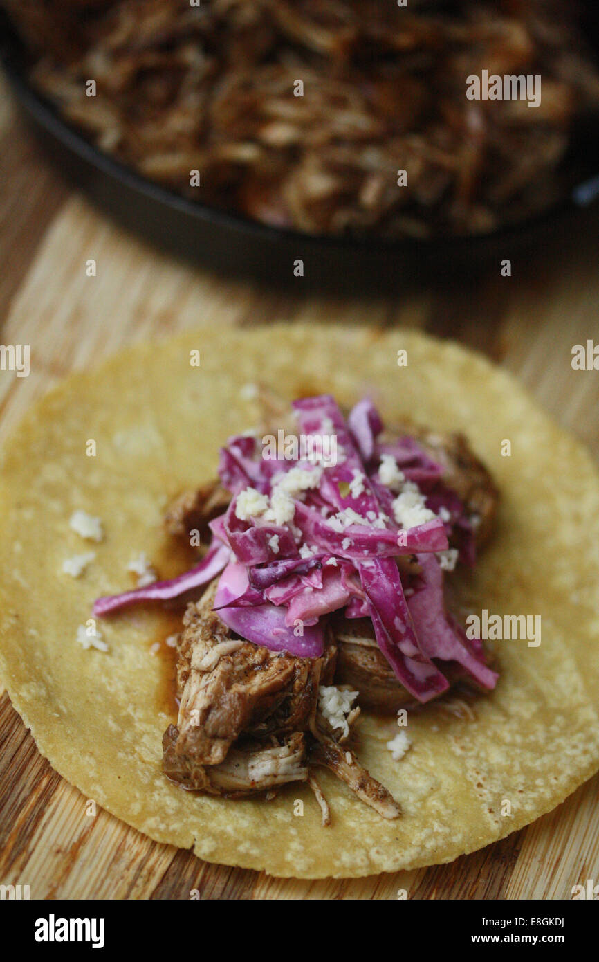 Pulled BBQ Chicken Tacos with red cabbage and diced onion Stock Photo