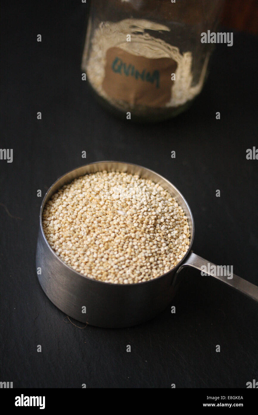 Quinoa in metal saucepan Stock Photo