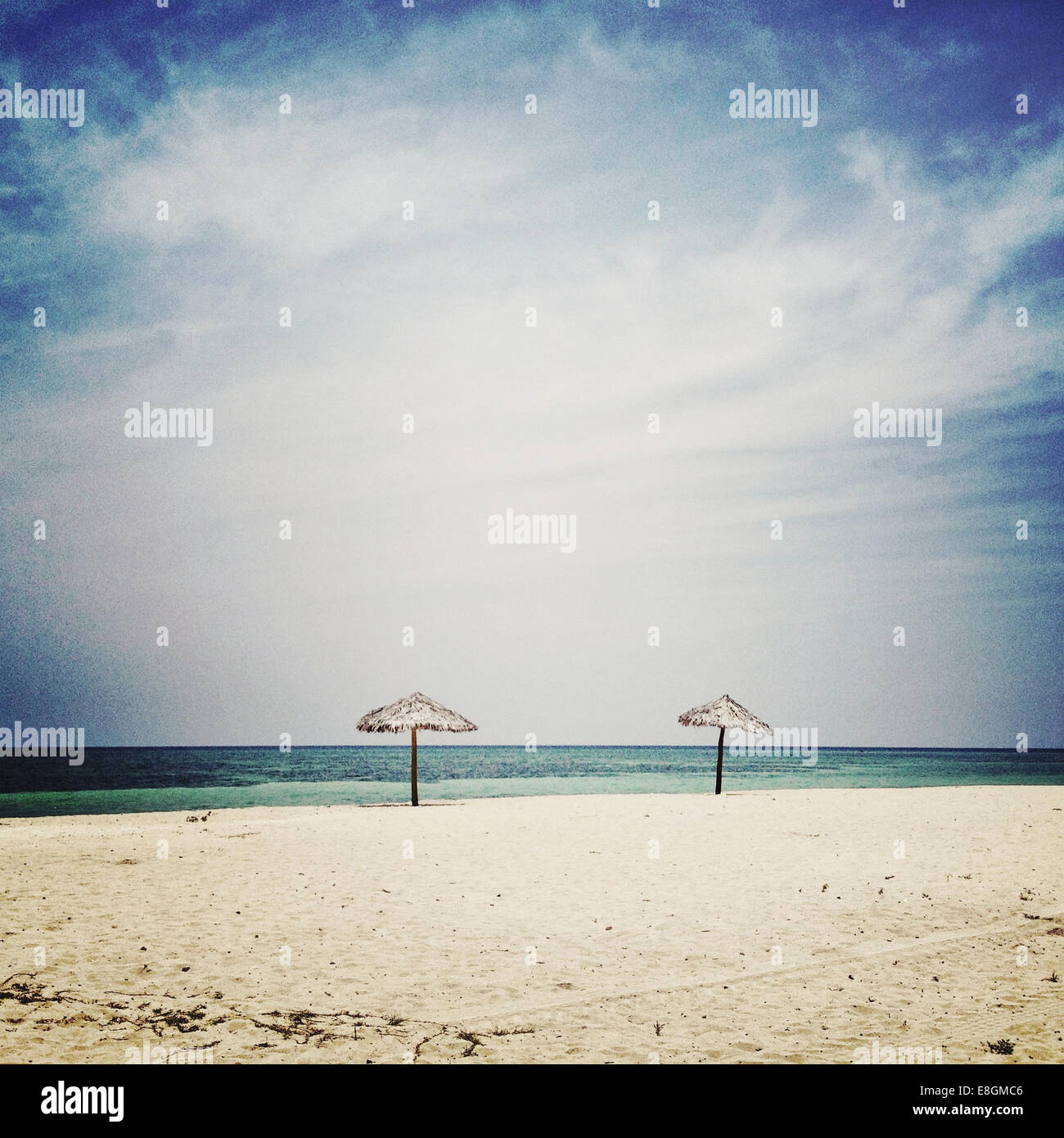 Two sun Umbrellas on beach Stock Photo Alamy