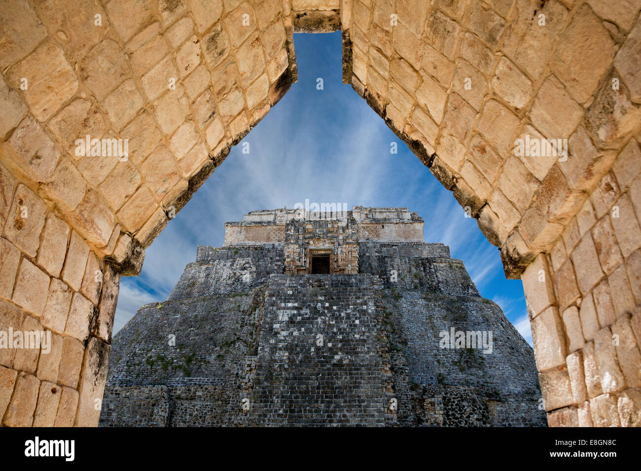 The pyramid of the magician, Uxmal, Yucatan, Mexico (seen through an arch) Stock Photo