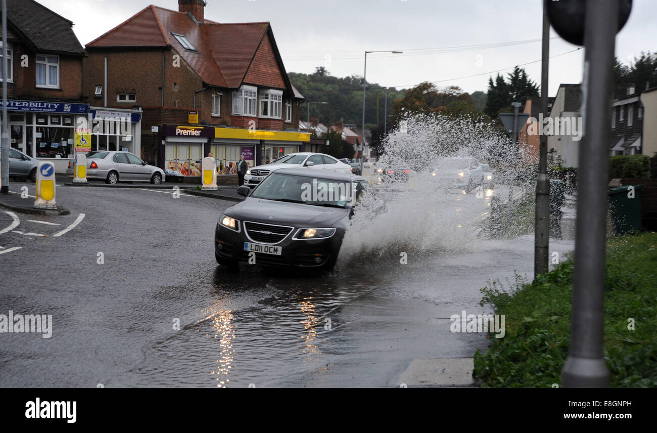Brighton, UK. 8th October, 2014. Cars drive through floodwater in Patcham Brighton today as heavy rain hit the south coast Stock Photo