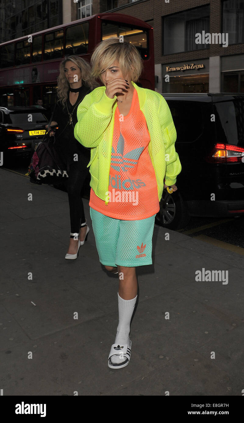 Rita Ora leaves her management offices and heads to Sloane Street to go  shopping. Ora was wearing a typically outlandish Adidas outfit, comprising  of a neon jacket, orange t-shirt, green shorts and