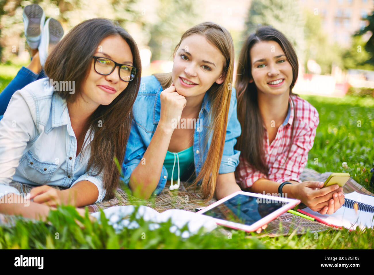 Teenage girl lying on lawn hi-res stock photography and images - Alamy
