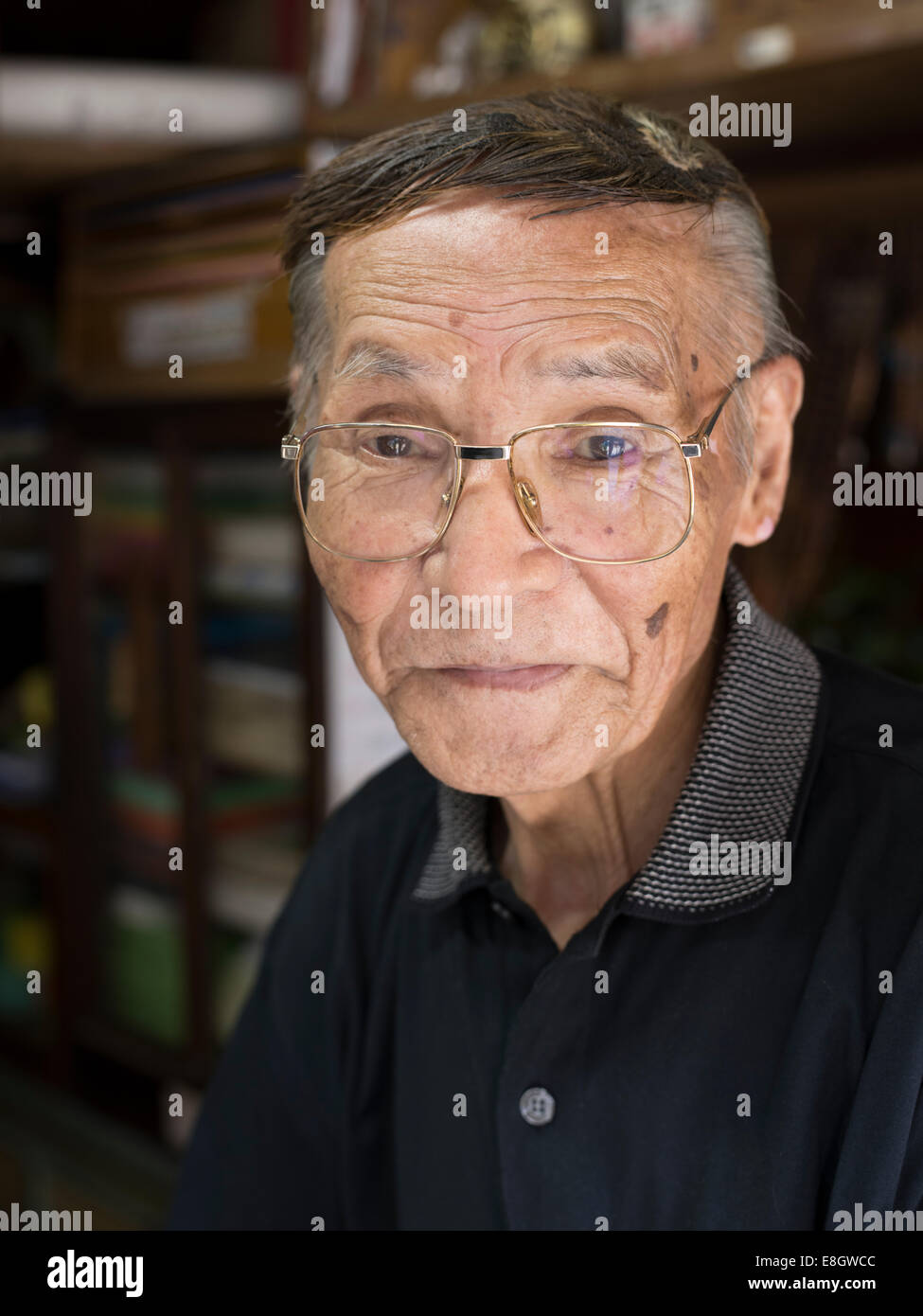 Murao (83) a tobacconist in his store on Naoshima, Japan Stock Photo