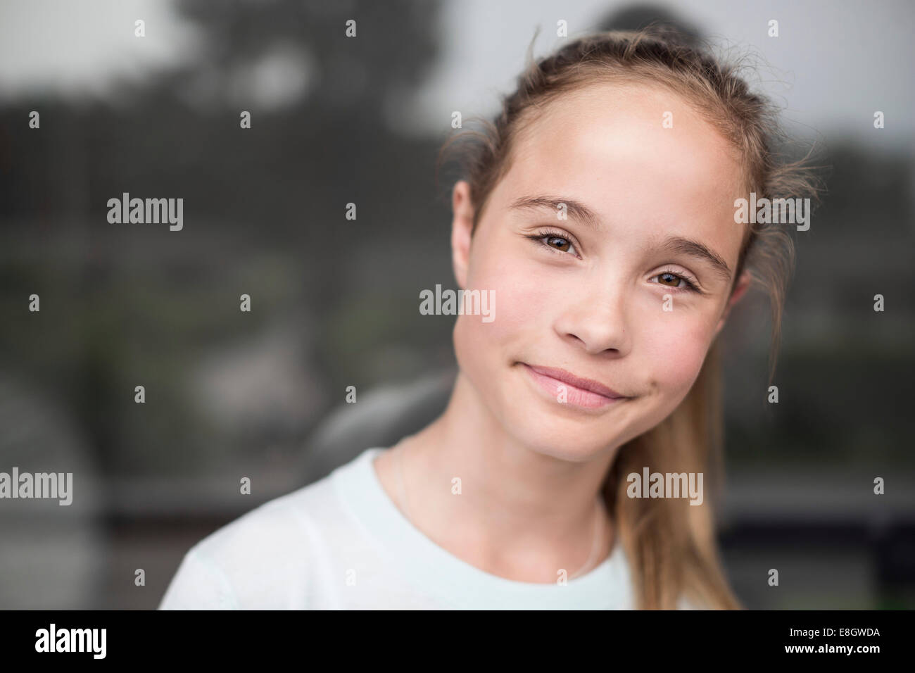 Portrait of girl smiling outdoors Stock Photo - Alamy