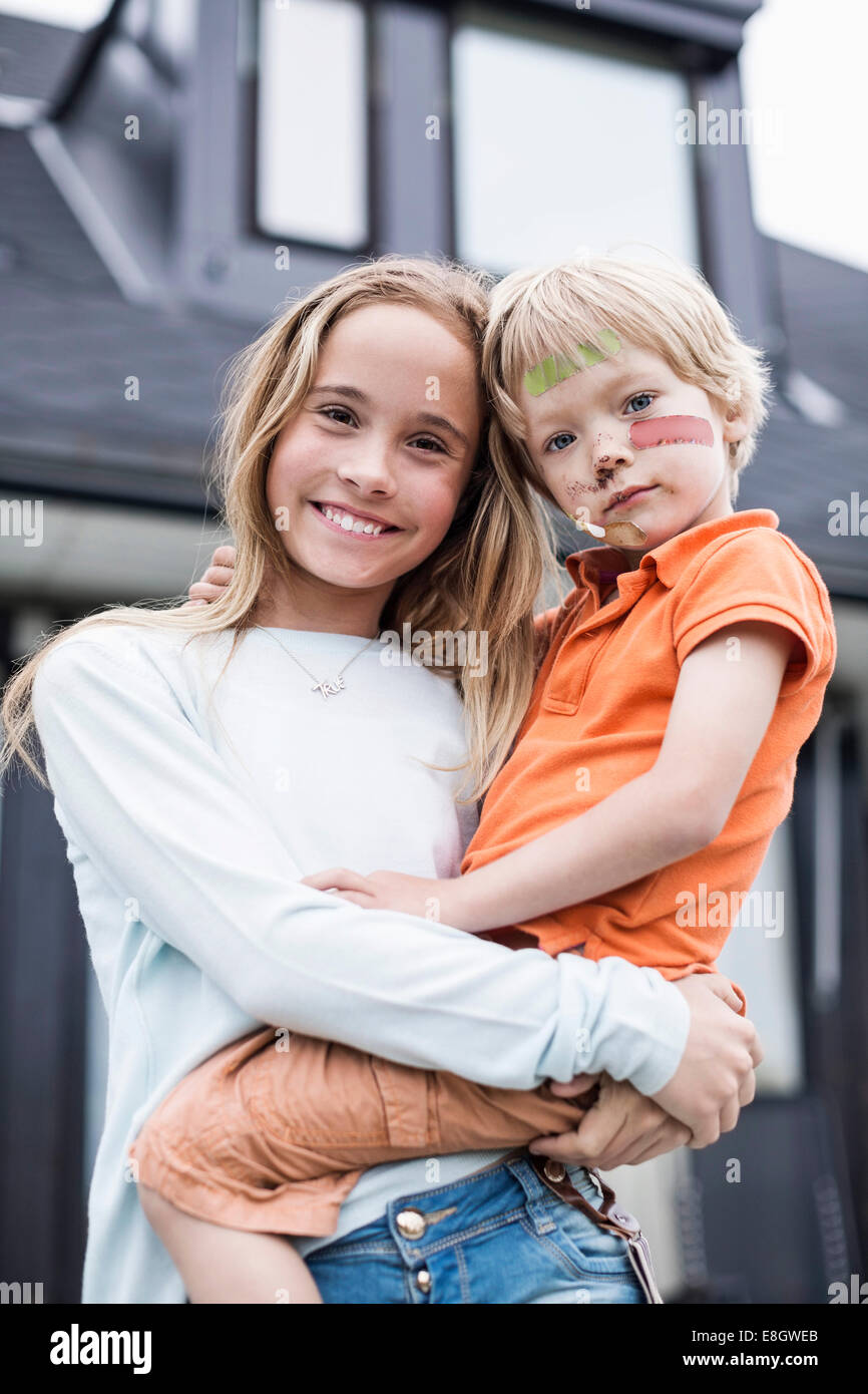 Girl top carrying boy