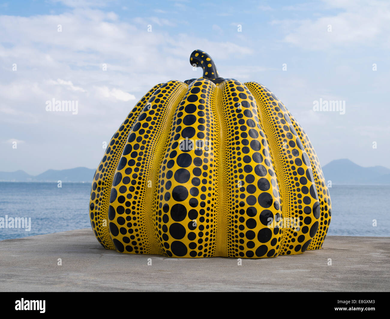 Giant yellow pop art pumpkin by the Japanese artist Yayoi Kusama. Benesse Art Site Naoshima, Japan Stock Photo