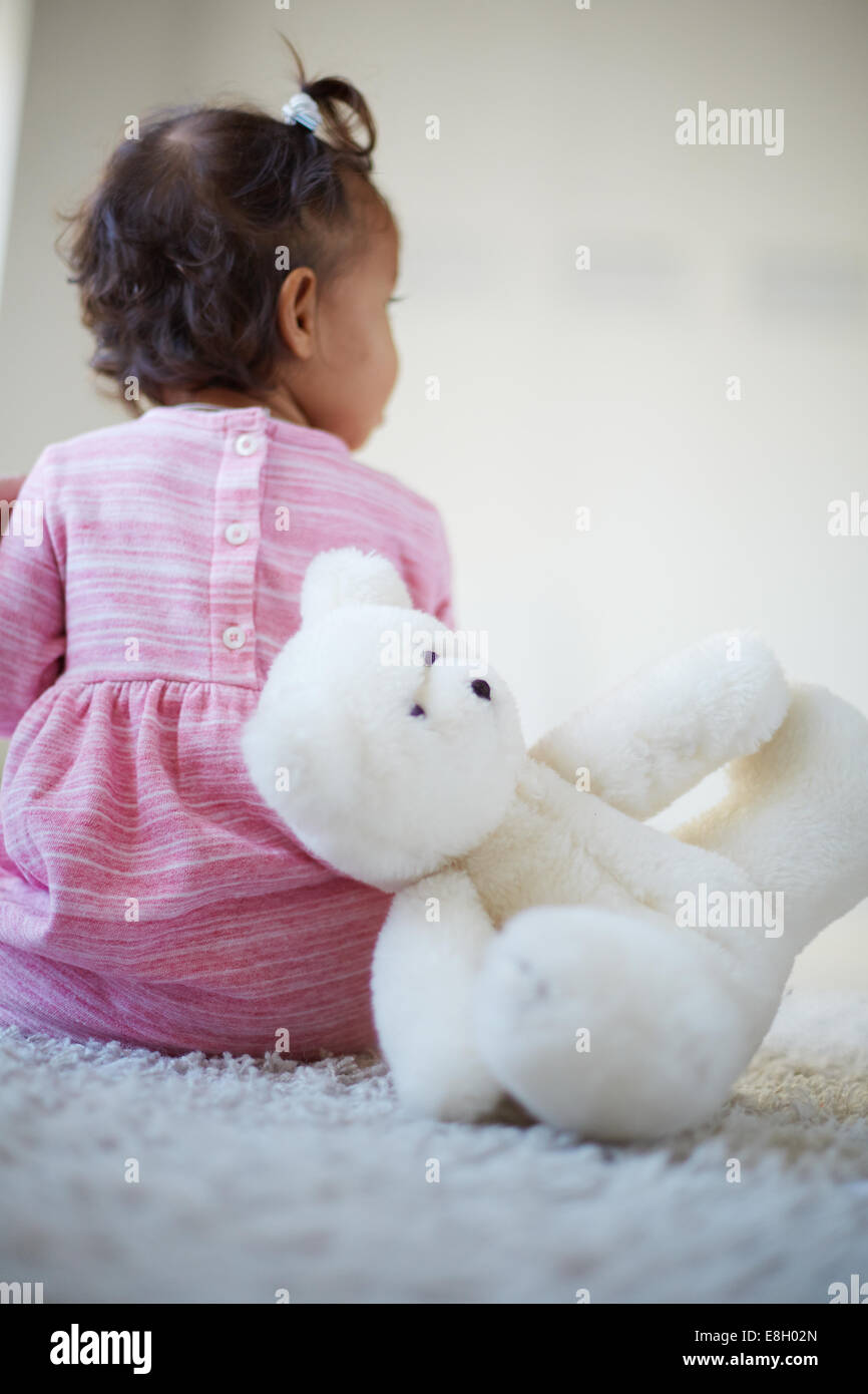 Rear view little girl sitting hi-res stock photography and images - Alamy