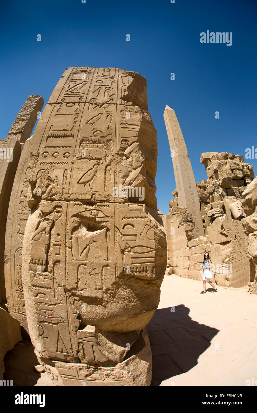 Egypt, Luxor, Karnak Temple, tourist amongst ruins covered in hieroglyphics Stock Photo