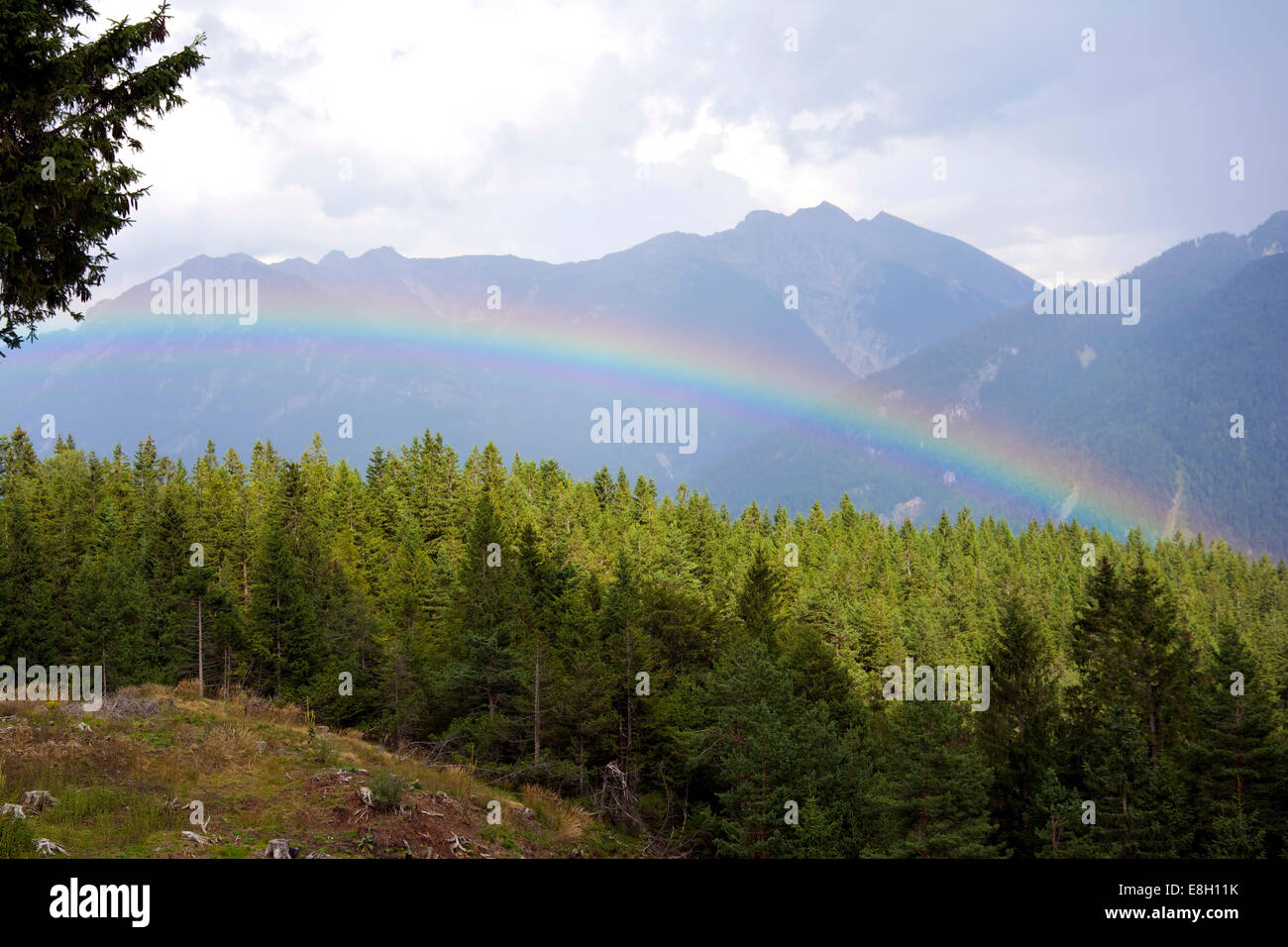 Rainbow seen from above. Photo shot in the Bavarian Alps. Stock Photo