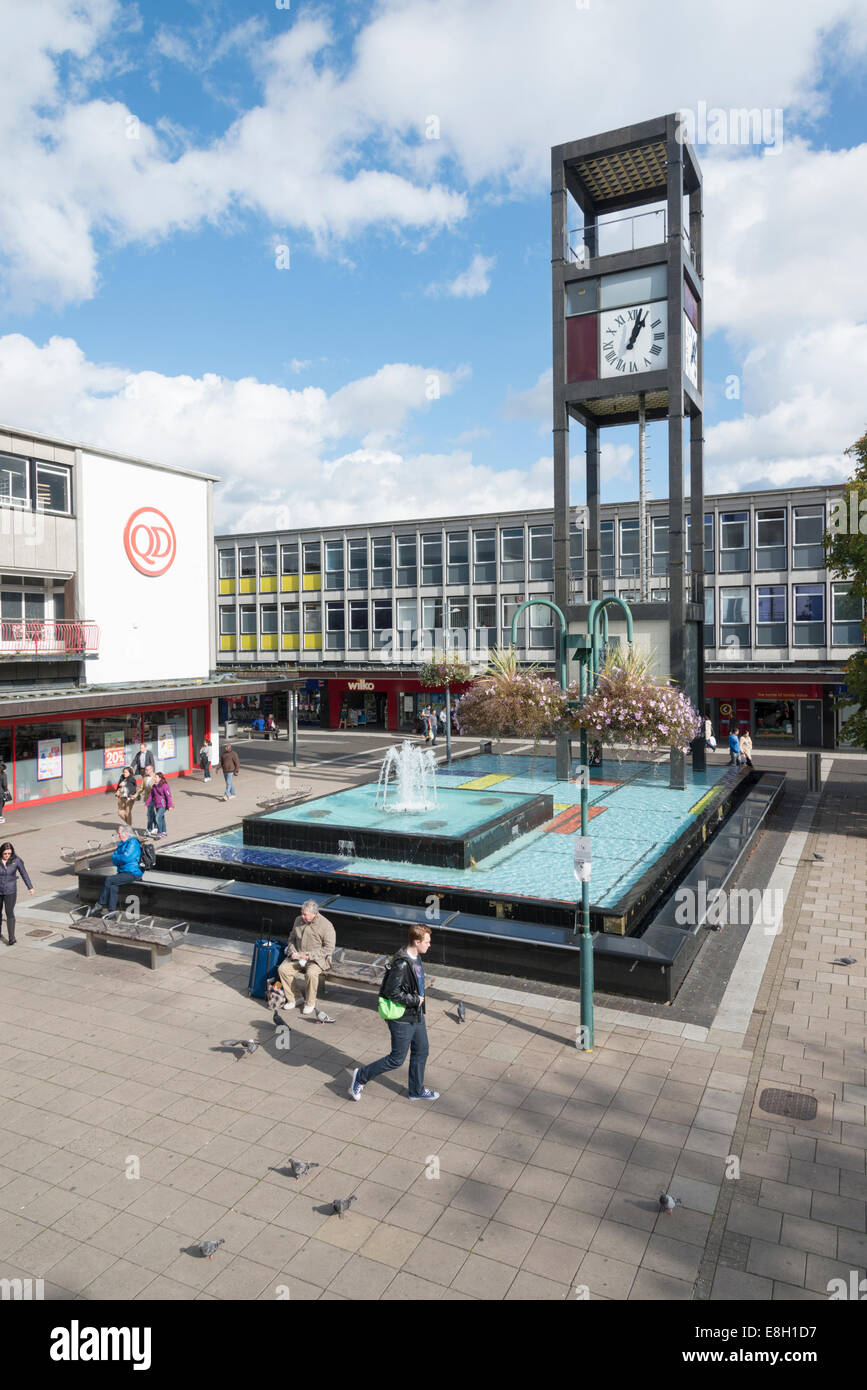 People and shops in the central square in Stevenage town centre Hertfordhshire UK showing  the clock tower and fountains. Stock Photo