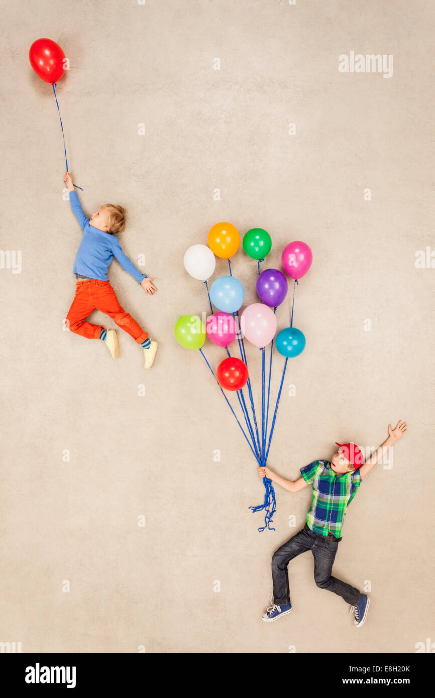 Children flying away on balloons Stock Photo - Alamy