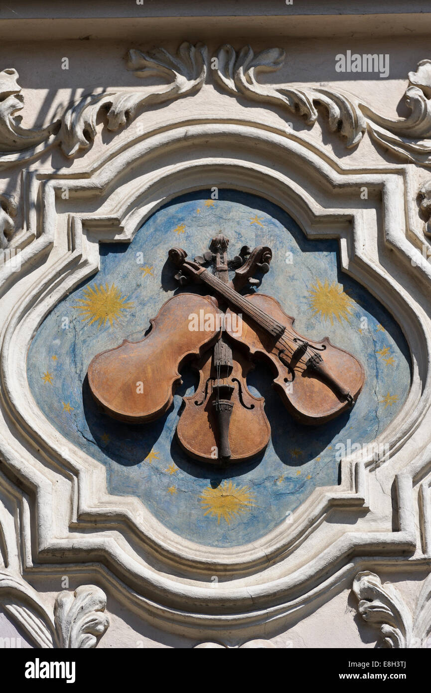 A popular house sign - 'Three Fiddles' in the City of Prague, Czech Republic. Stock Photo