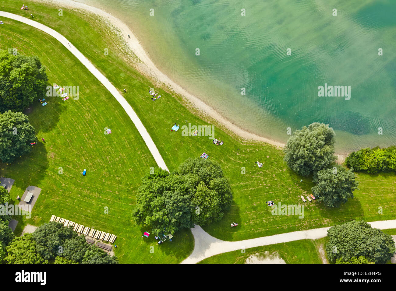 Germany, Bavaria, Feldkirchen, aerial view of people at lakeshore Stock Photo