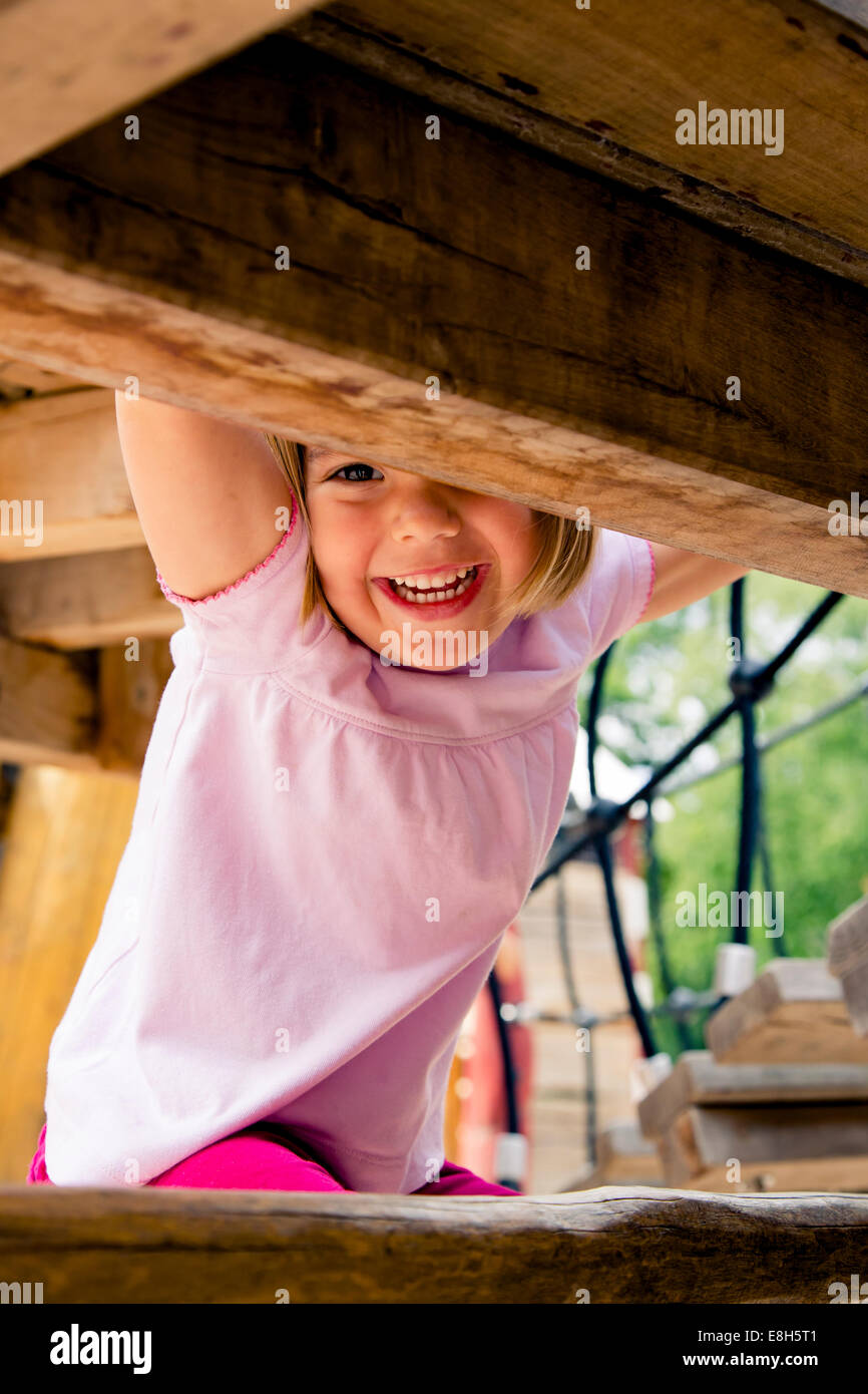 Happy little girl on playground Stock Photo - Alamy