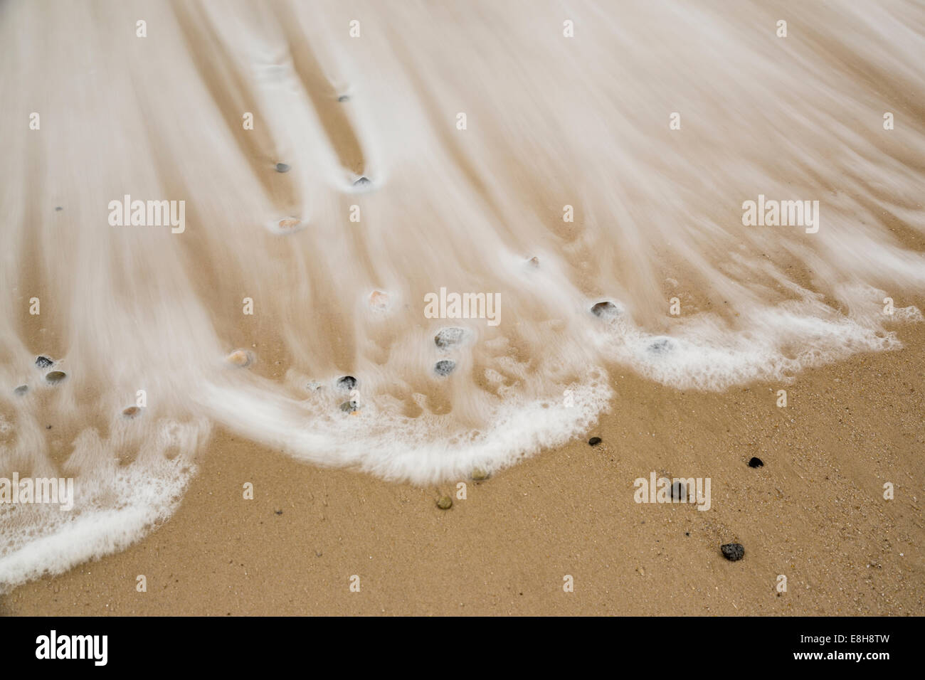 Waves sandy beach hi-res stock photography and images - Alamy