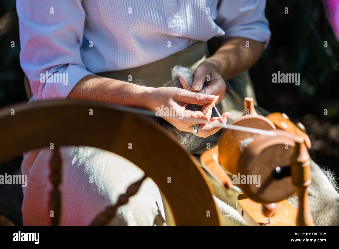 Wool spinning with vintage tools on old estate Stock Photo - Alamy