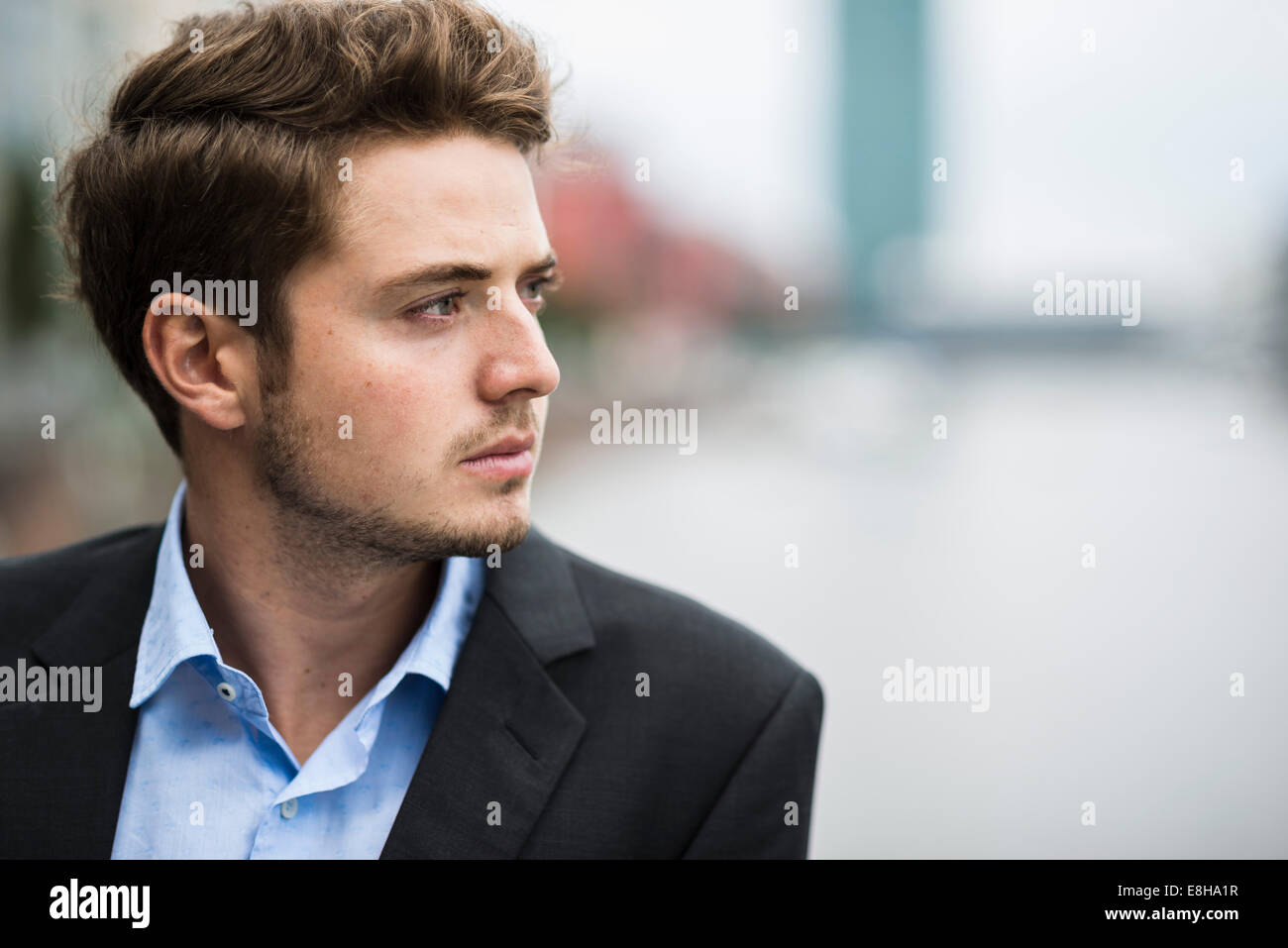 Germany, Hesse, Frankfurt, portrait of pensive young man Stock Photo ...