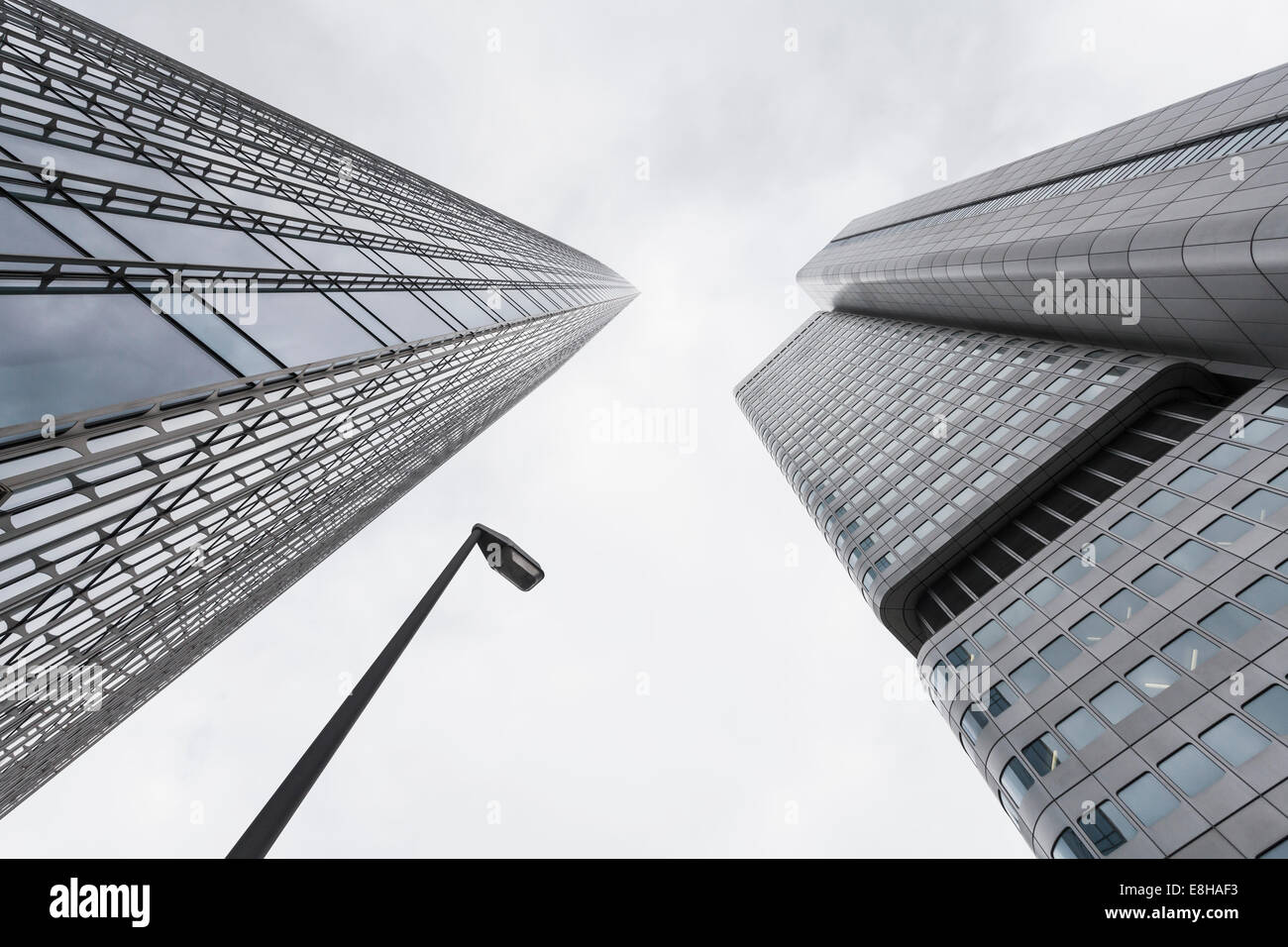 Germany, Hesse, Frankfurt, view to facades of modern office buildings Skyper and Silver Tower from below Stock Photo