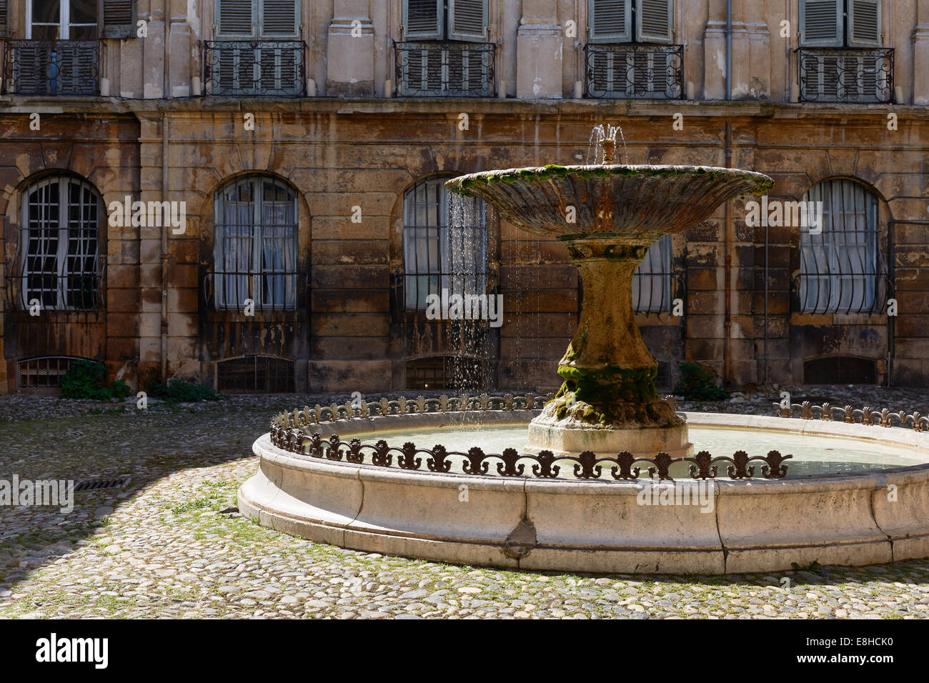Ancient fountain in old part of Aix en Provence town, South France Stock Photo