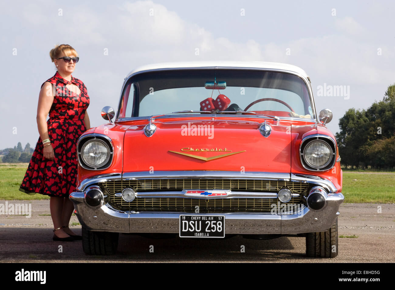 1957 Chevrolet. Chevy. Classic American car with Lady dressed in 1950s  clothing Stock Photo - Alamy