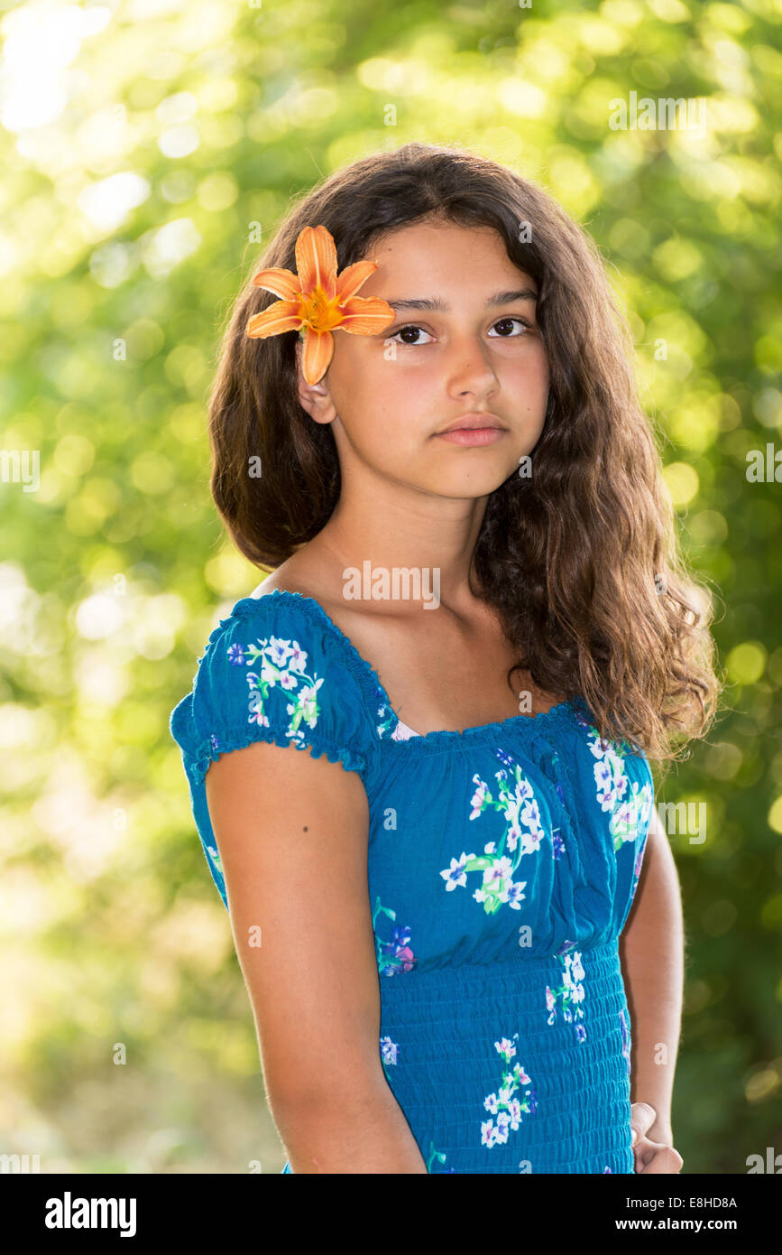 Teen girl with curly dark hair on nature Stock Photo - Alamy